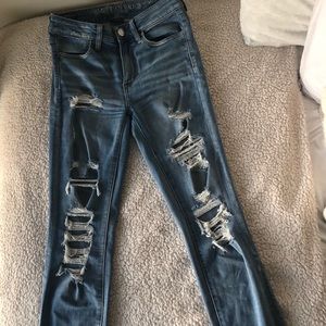 Distressed ankle jeans